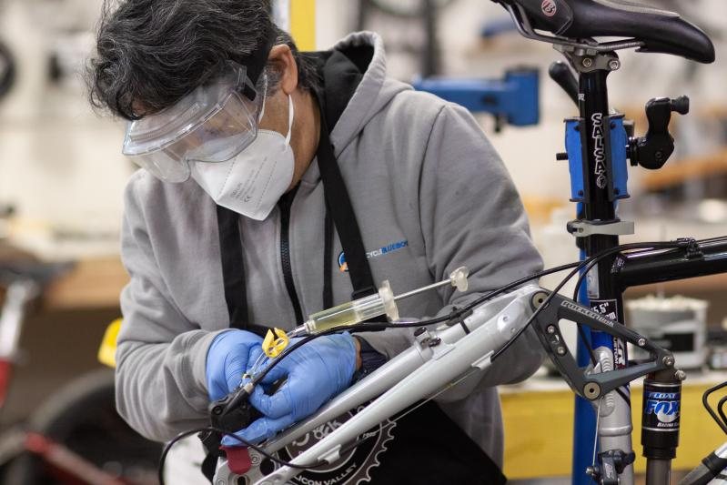 Gregg Kato bleeds the hydraulic brakes on a Knolly Endorphin full suspension mountain bike. 