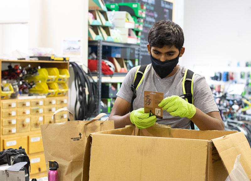 Shree Sandilya sorts donated bike parts at the Silicon Valley Bicycle Exchange. 