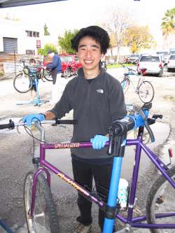 Teenager fixing bicycle