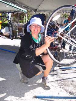 woman fixing bicycle